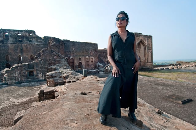 Olga B. Aaron photographed in traditional attire at Rangeen Mahal's entrance