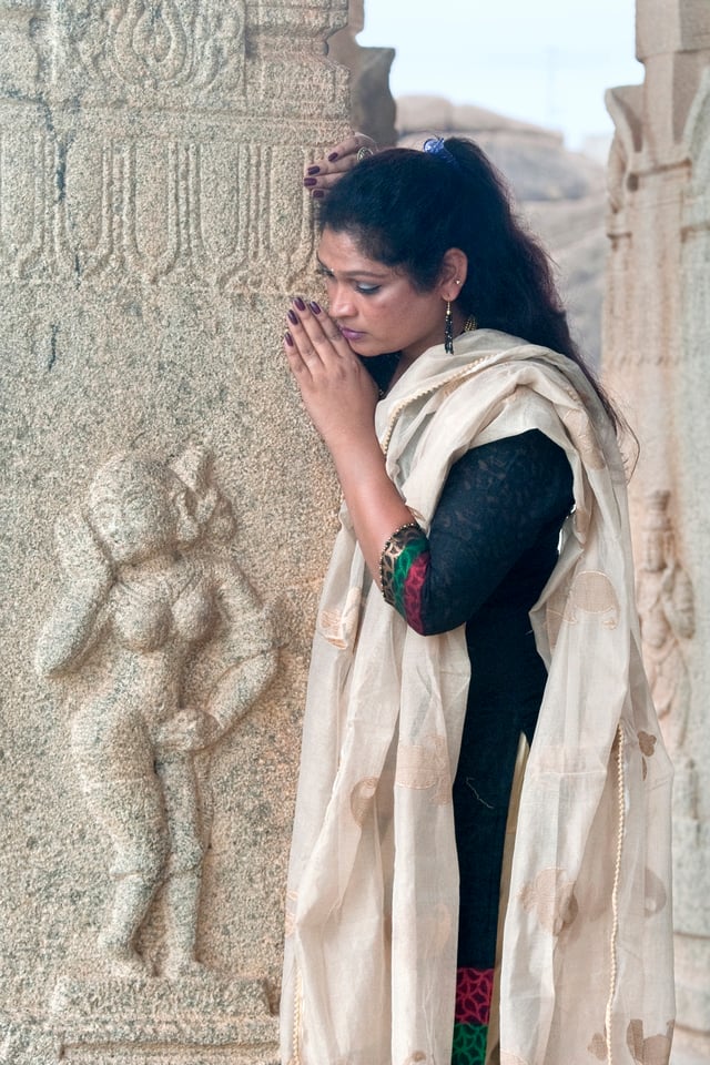 Exploring Hampi's ancient temples, revealing the intricate designs and historical importance.